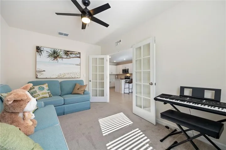 Bedroom featuring carpet and a ceiling fan
