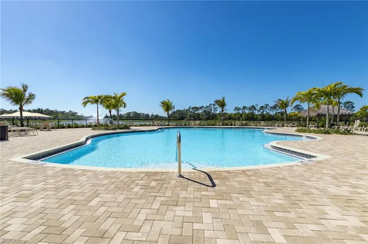Community pool featuring a patio