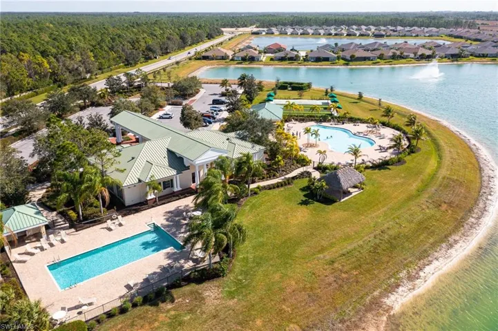 Aerial perspective of suburban area with a large body of water