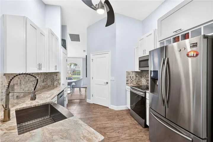 Update kitchen with granite countertops and stainless steel appliances