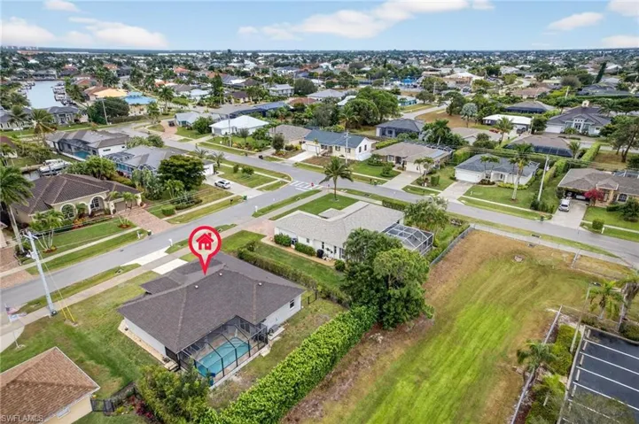 Aerial view. Located in quiet neighborhood close to beach, recreation, shopping, and schools.