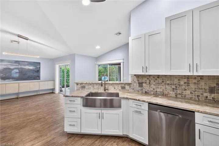 Update kitchen with granite countertops and stainless steel appliances