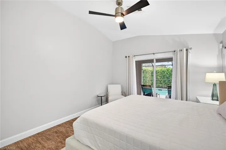 Master bedroom with sliding doors out to pool/lanai