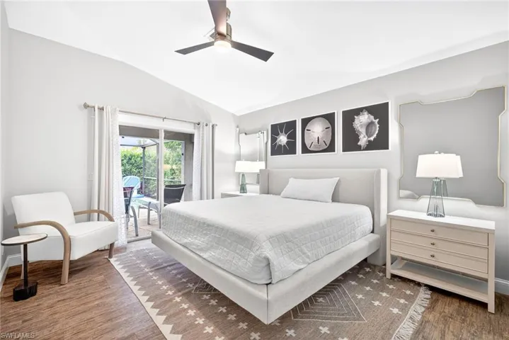 Master bedroom with sliding doors out to pool/lanai