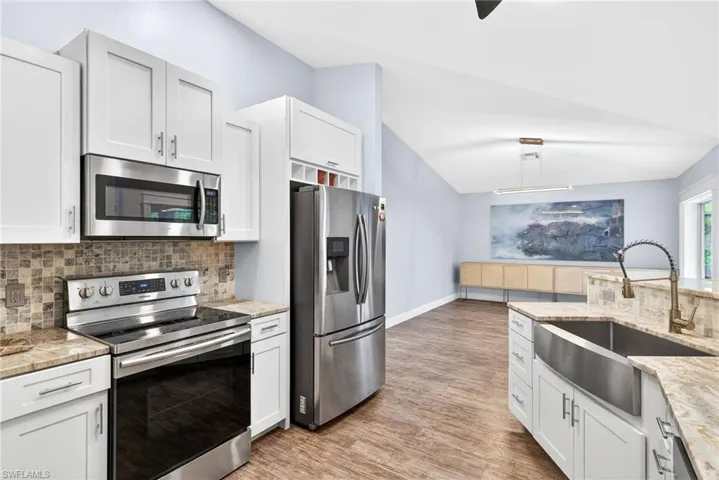Update kitchen with granite countertops and stainless steel appliances