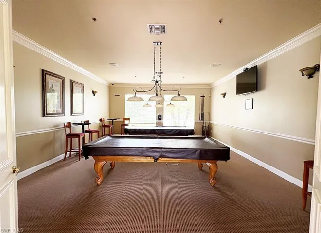 Recreation room featuring billiards table, carpet floors, and ornamental molding