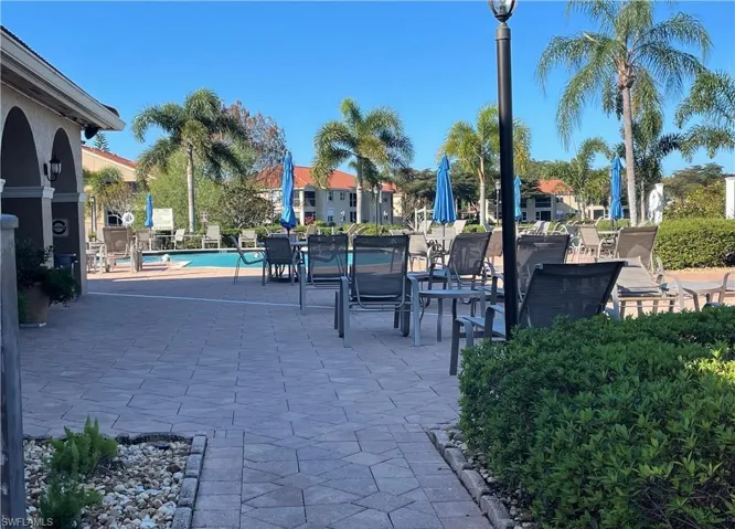 View of home's community featuring a patio area, a pool.