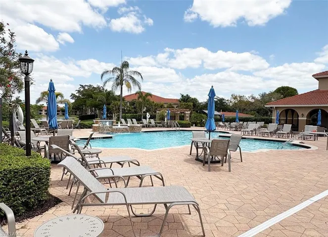Community pool with a patio area
