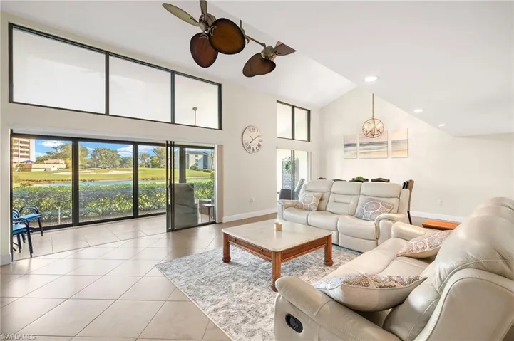 Living area featuring high vaulted ceiling