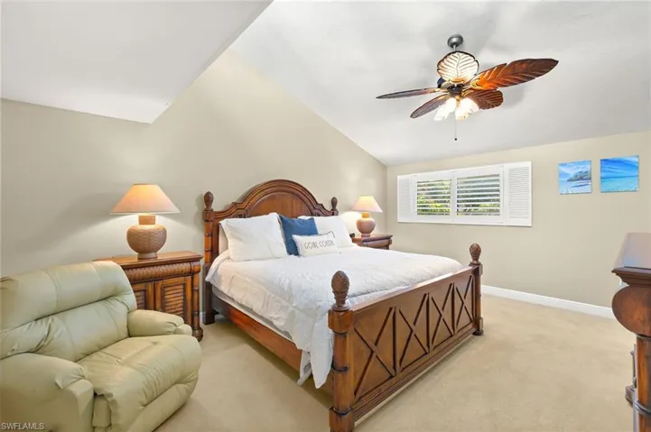 Bedroom featuring vaulted ceiling