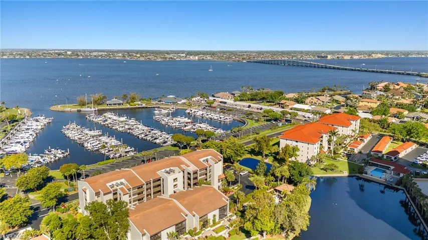 Birds eye view of property with a water view