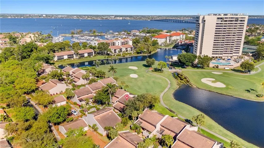 Drone / aerial view with a water view and view of golf course