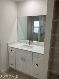 Bathroom featuring hardwood / wood-style floors and vanity