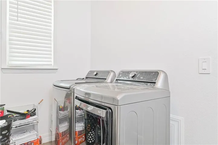 Laundry area with separate washer and dryer