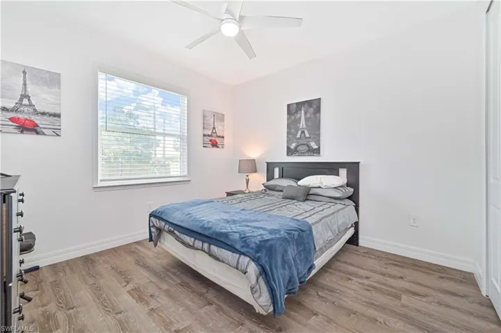 Bedroom featuring wood finished floors and ceiling fan