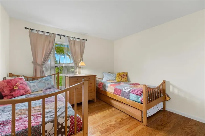 Bedroom featuring wood-type flooring