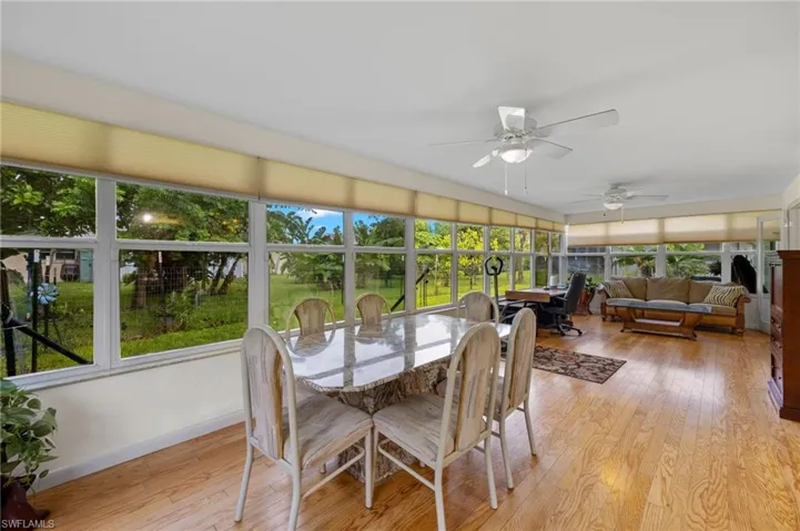 Sunroom / solarium with ceiling fan and a wealth of natural light