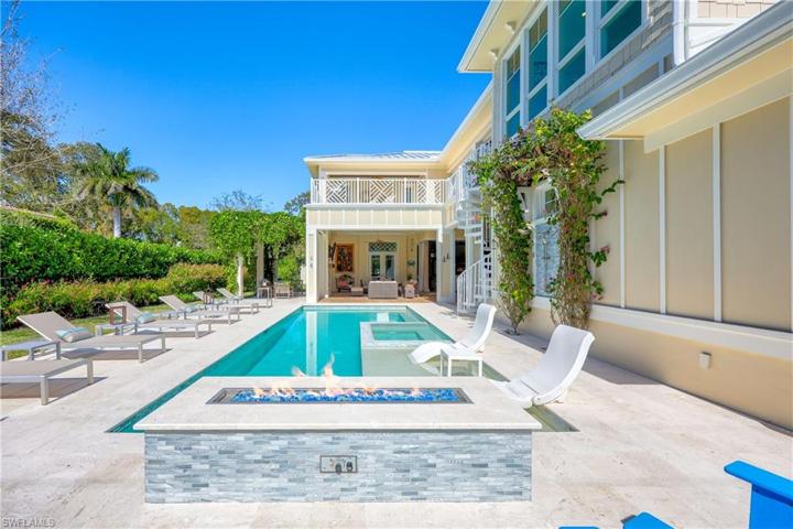 Outdoor pool area with fire pit