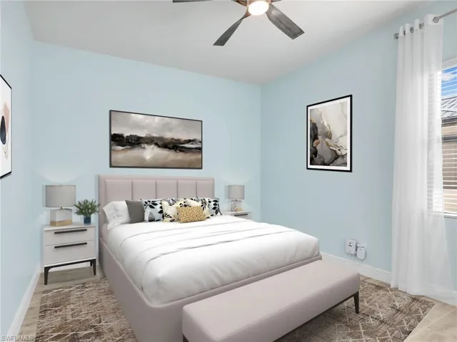 Bedroom with ceiling fan and light wood-type flooring. ***ROOM IS VIRTUALLY STAGED
