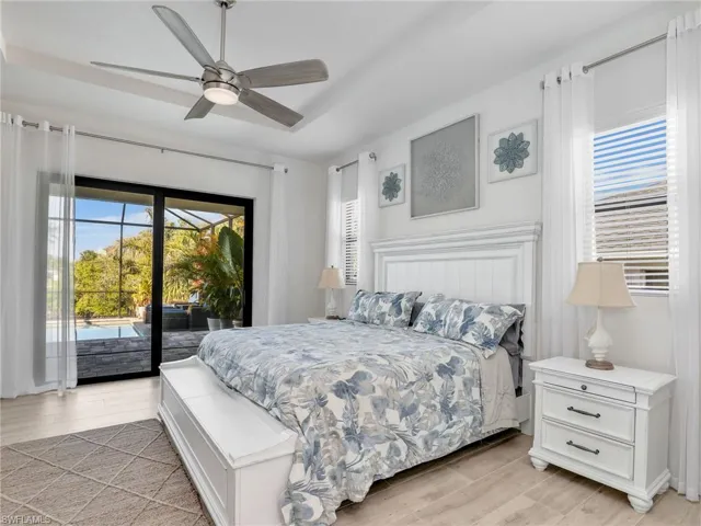 Bedroom featuring access to exterior and ceiling fan