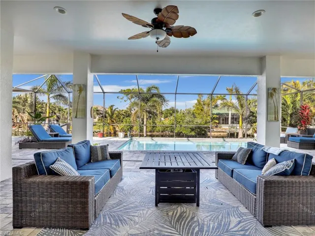View of patio with ceiling fan, an outdoor hangout area, and a lanai