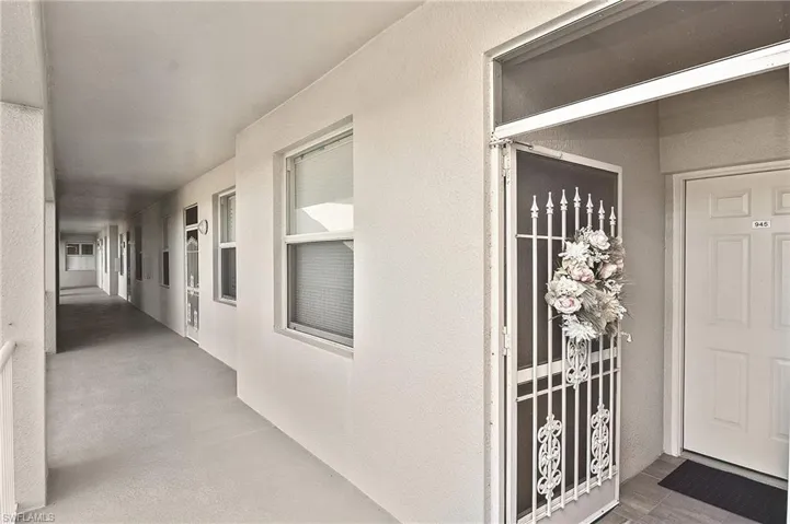 Property entrance featuring stucco siding