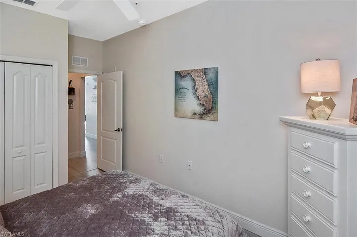 Bedroom with a ceiling fan and a closet