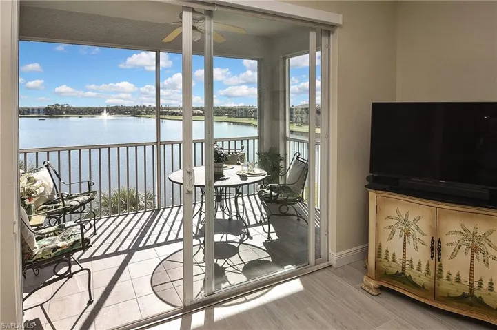 Balcony featuring a sunroom