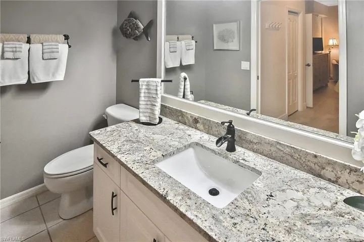 Bathroom featuring vanity and light tile patterned floors
