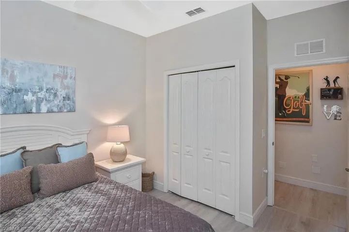 Bedroom featuring light wood finished floors and a closet
