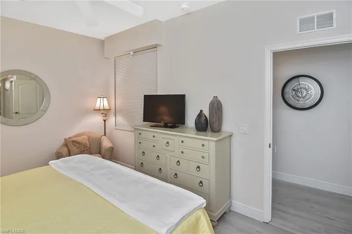 Bedroom featuring a ceiling fan and light wood-type flooring