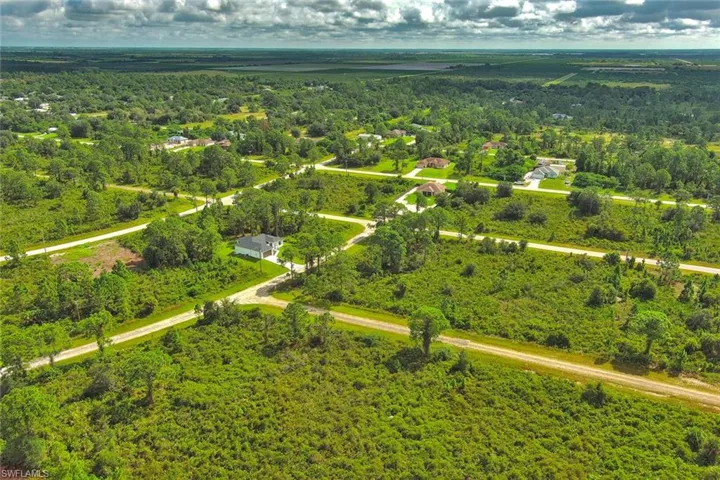 Aerial overview of property's location featuring a forest