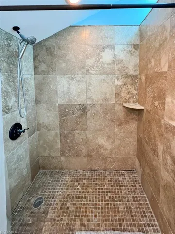 Bathroom with a tile shower