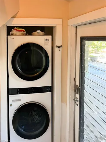 Laundry room featuring stacked washer / dryer