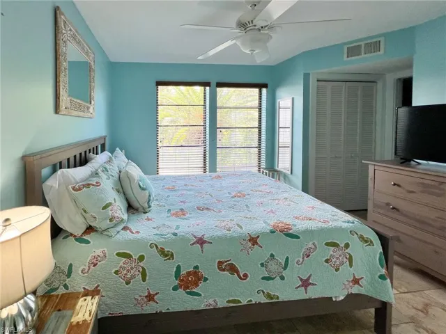 Bedroom featuring ceiling fan and a closet