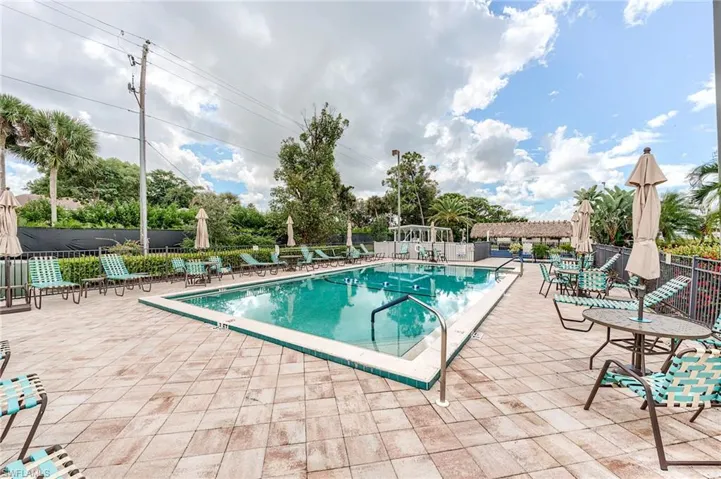 Community pool with a patio