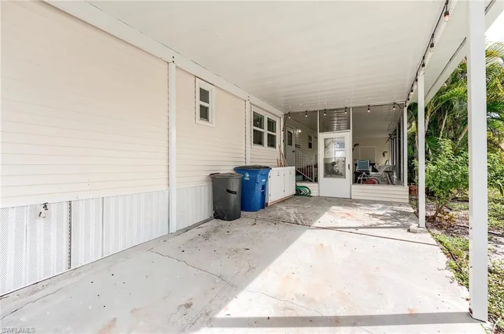 View of patio / terrace featuring a carport