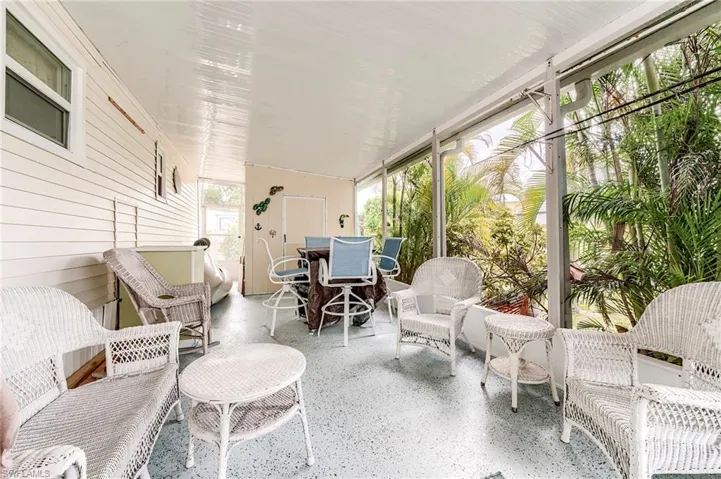 Sunroom with outdoor dining space