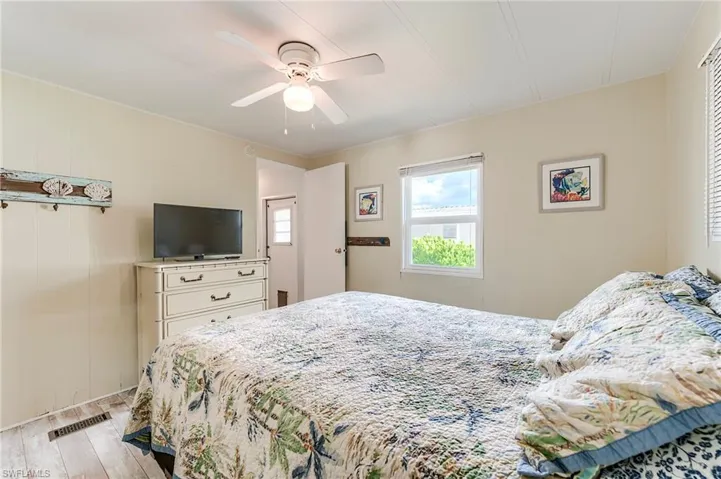 Bedroom with light wood-type flooring and a ceiling fan