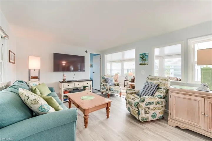 Living area with light wood-style flooring