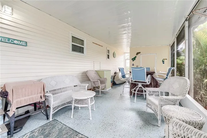 Sunroom featuring outdoor dining area