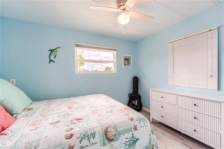 Bedroom featuring light wood-type flooring and ceiling fan