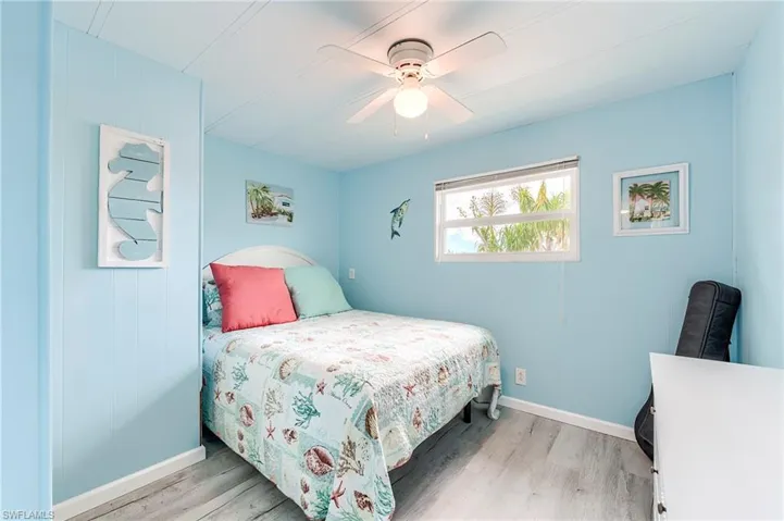 Bedroom featuring light wood-type flooring and ceiling fan