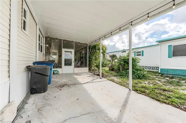 View of patio with a carport