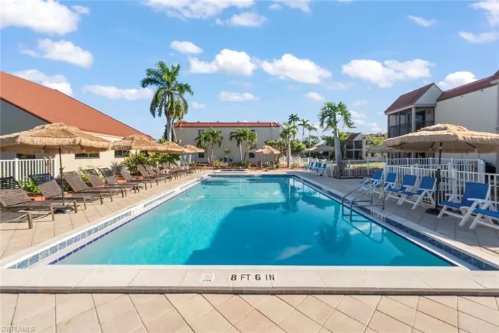 Community pool with a patio