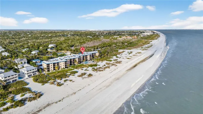 Aerial view of waterfront with a beach