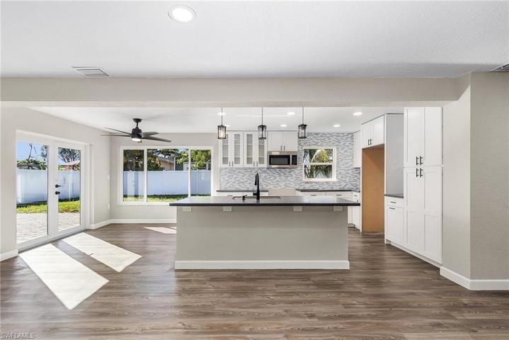 Light and bright kitchen with French doors to the patio.