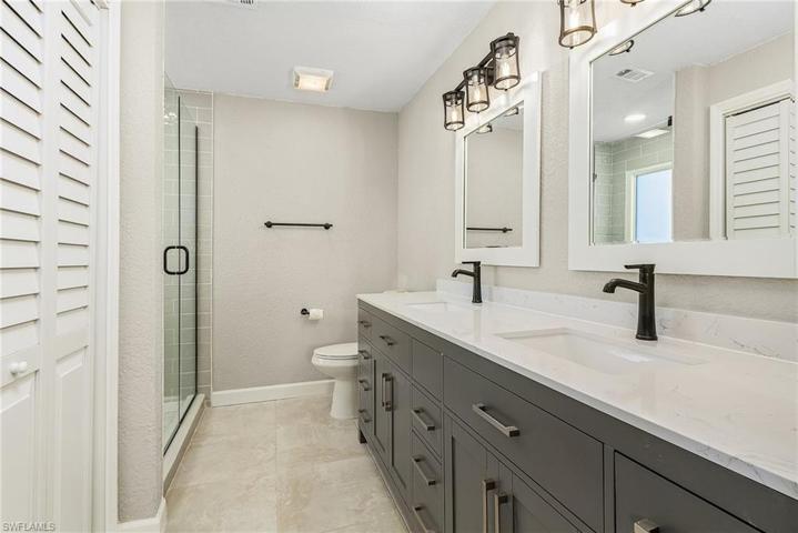 Two sinks and a spacious shower.