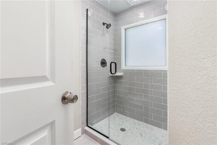 Guest bathroom with roomy shower.