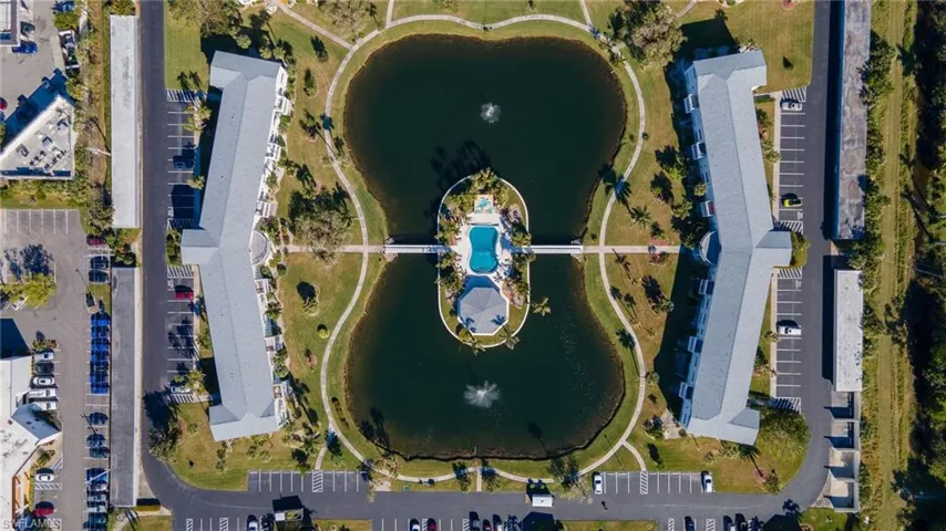 Aerial view of property's location with a large body of water